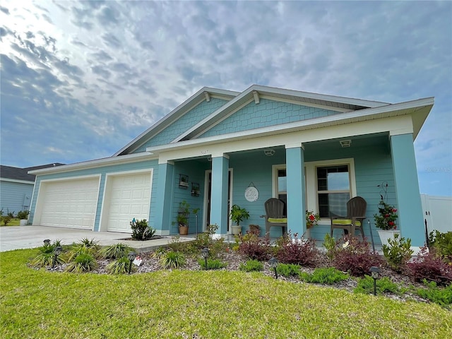 5667 SW 92nd Pl, Ocala, FL 34476 - view of front facade featuring driveway, a garage, covered porch, and a front lawn