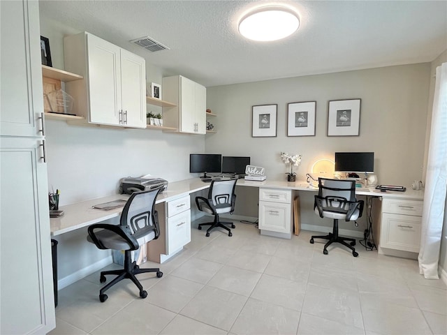 5667 SW 92nd Pl, Ocala, FL 34476 - office featuring built in study area, a textured ceiling, and light tile patterned floors