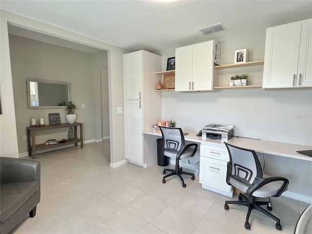 5667 SW 92nd Pl, Ocala, FL 34476 - office area featuring built in desk, light tile patterned flooring, and a textured ceiling