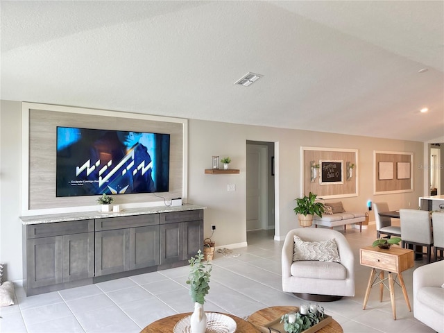 5667 SW 92nd Pl, Ocala, FL 34476 - living room featuring light tile patterned floors and baseboards