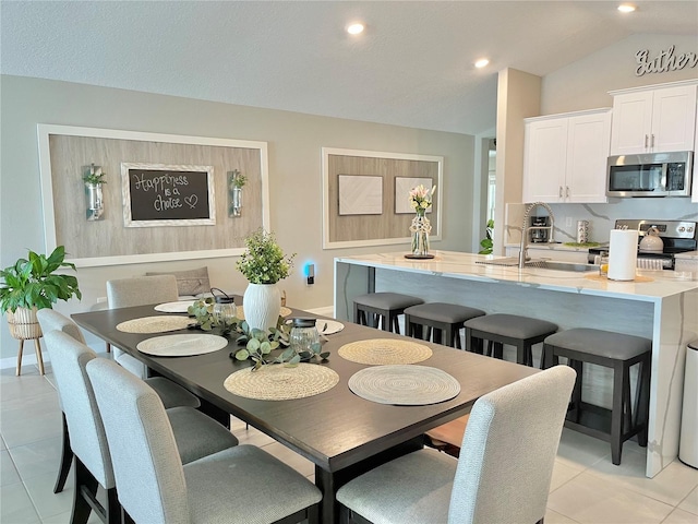 5667 SW 92nd Pl, Ocala, FL 34476 - dining area featuring lofted ceiling, light tile patterned flooring, and recessed lighting