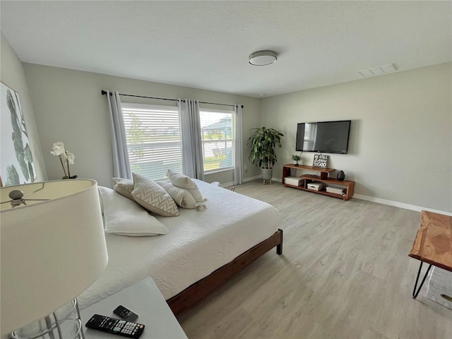 5667 SW 92nd Pl, Ocala, FL 34476 - bedroom with light wood-style flooring and baseboards