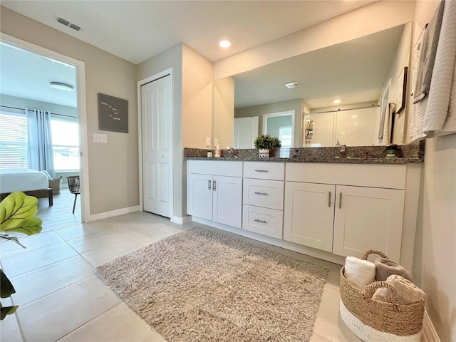 5667 SW 92nd Pl, Ocala, FL 34476 - full bathroom featuring double vanity, baseboards, a stall shower, tile patterned flooring, and recessed lighting