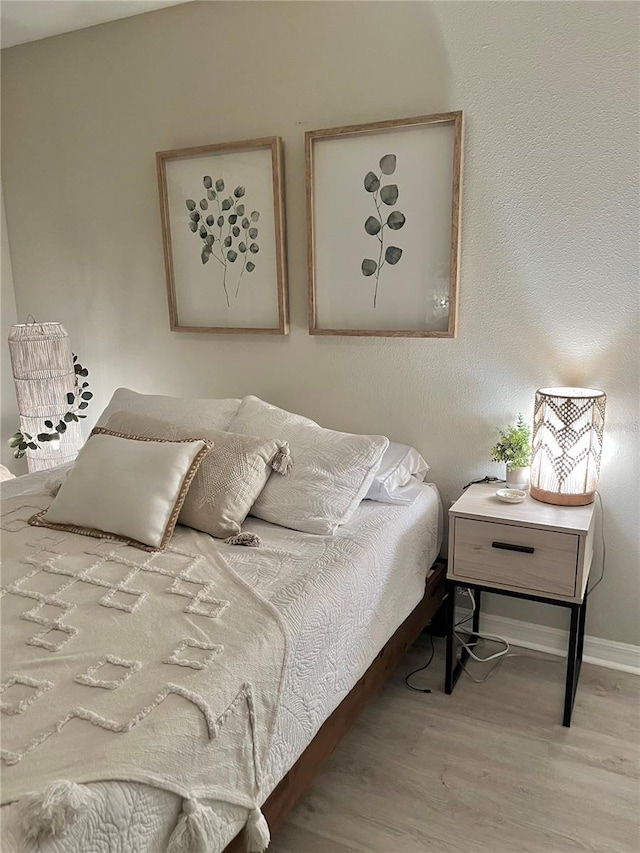 5667 SW 92nd Pl, Ocala, FL 34476 - bedroom featuring wood finished floors and baseboards