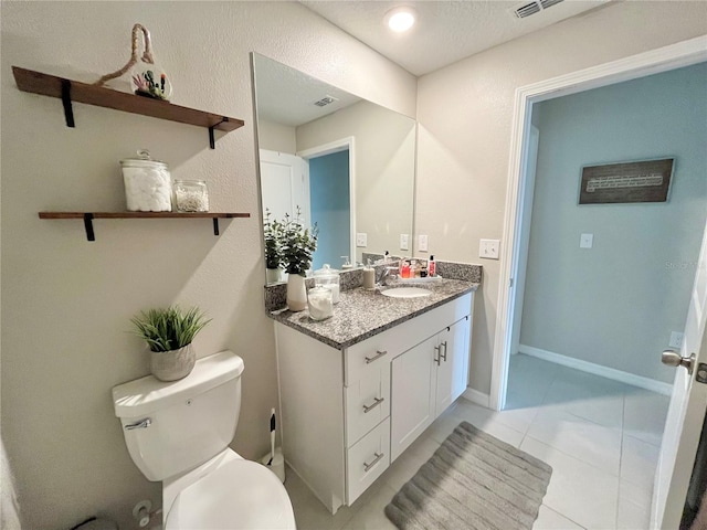 5667 SW 92nd Pl, Ocala, FL 34476 - bathroom with vanity, toilet, tile patterned floors, and baseboards