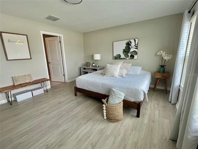 5667 SW 92nd Pl, Ocala, FL 34476 - bedroom featuring light wood-type flooring and baseboards