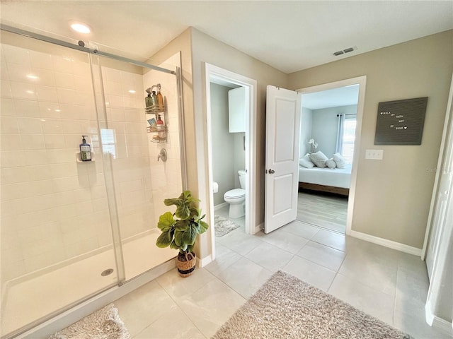 5667 SW 92nd Pl, Ocala, FL 34476 - full bath with toilet, ensuite bath, a shower stall, baseboards, and tile patterned flooring