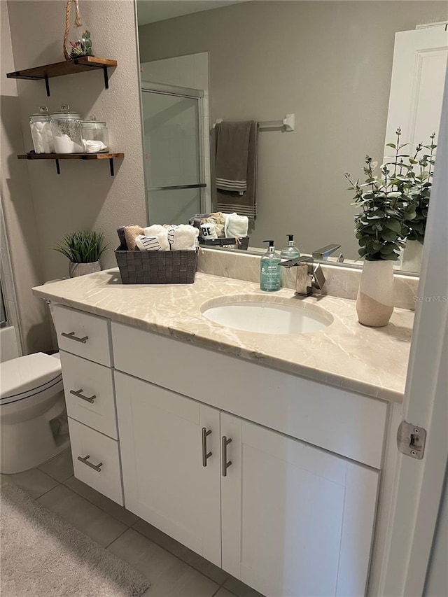 5667 SW 92nd Pl, Ocala, FL 34476 - full bath with vanity, a shower with shower door, tile patterned flooring, and toilet