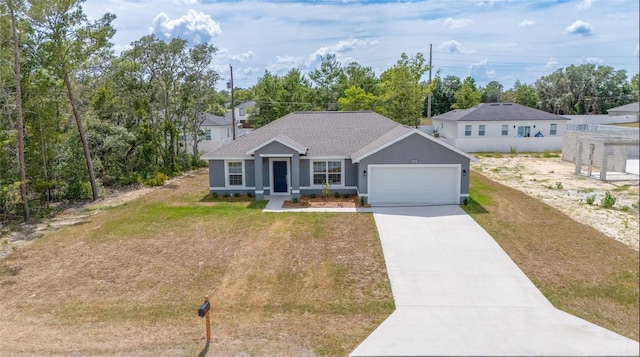400 Marion Oaks Crse, Ocala, FL 34473 - ranch-style home featuring an attached garage, driveway, stucco siding, a front lawn, and roof with shingles