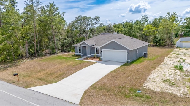 400 Marion Oaks Crse, Ocala, FL 34473 - view of front facade featuring a garage, a front yard, cooling unit, roof with shingles, and concrete driveway