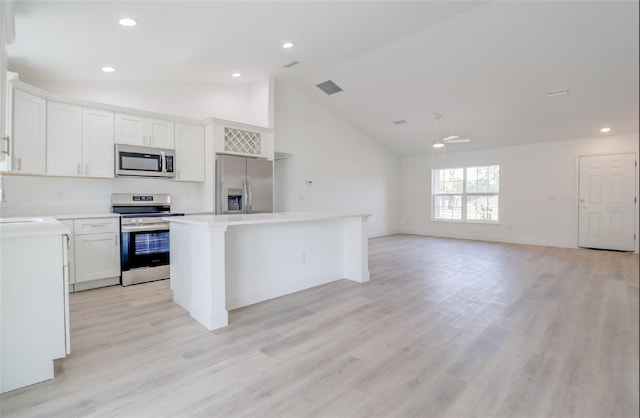 400 Marion Oaks Crse, Ocala, FL 34473 - kitchen featuring stainless steel appliances, a center island, high vaulted ceiling, white cabinets, and a ceiling fan