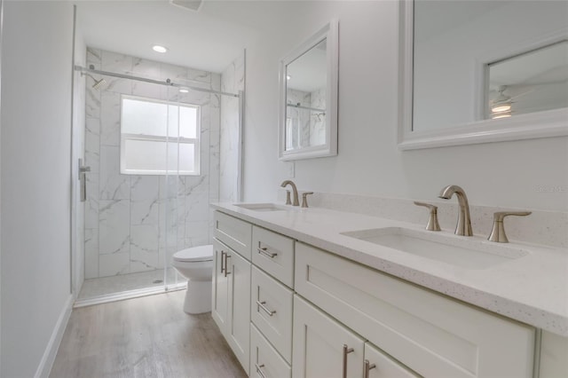 400 Marion Oaks Crse, Ocala, FL 34473 - full bathroom featuring toilet, a marble finish shower, double vanity, wood finished floors, and ceiling fan