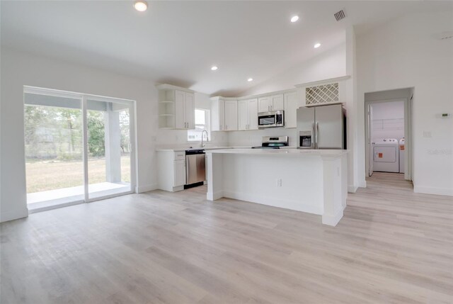 400 Marion Oaks Crse, Ocala, FL 34473 - kitchen featuring stainless steel appliances, open shelves, white cabinets, light countertops, and a center island