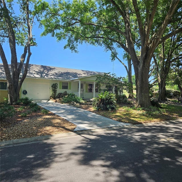 8635 SW 95th St Unit G, Ocala, FL 34481 - view of front of property with driveway and a garage