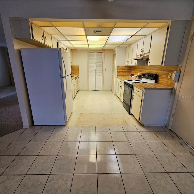 8635 SW 95th St Unit G, Ocala, FL 34481 - kitchen with electric range oven, freestanding refrigerator, a drop ceiling, and under cabinet range hood