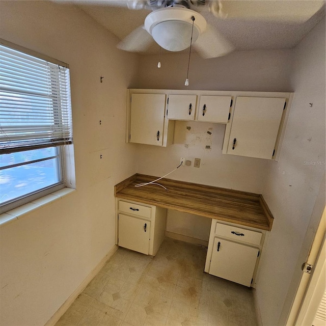 8635 SW 95th St Unit G, Ocala, FL 34481 - unfurnished office featuring ceiling fan, built in study area, baseboards, and light floors
