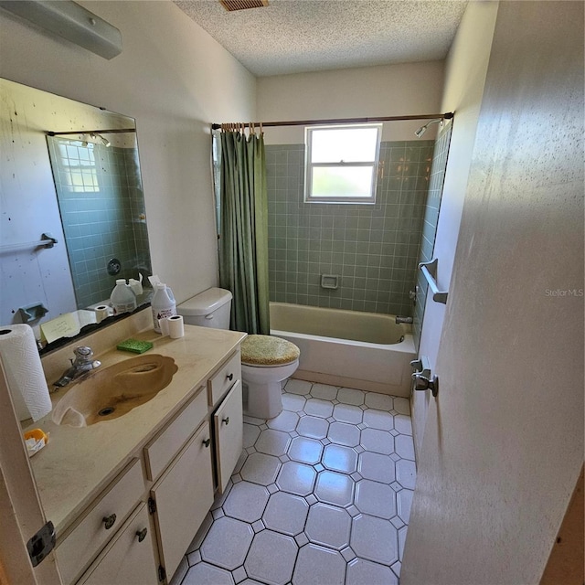 8635 SW 95th St Unit G, Ocala, FL 34481 - bathroom with toilet, vanity, shower / tub combo with curtain, and a textured ceiling