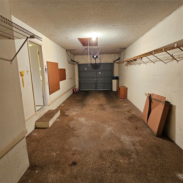 8635 SW 95th St Unit G, Ocala, FL 34481 - garage featuring concrete block wall and a garage door opener
