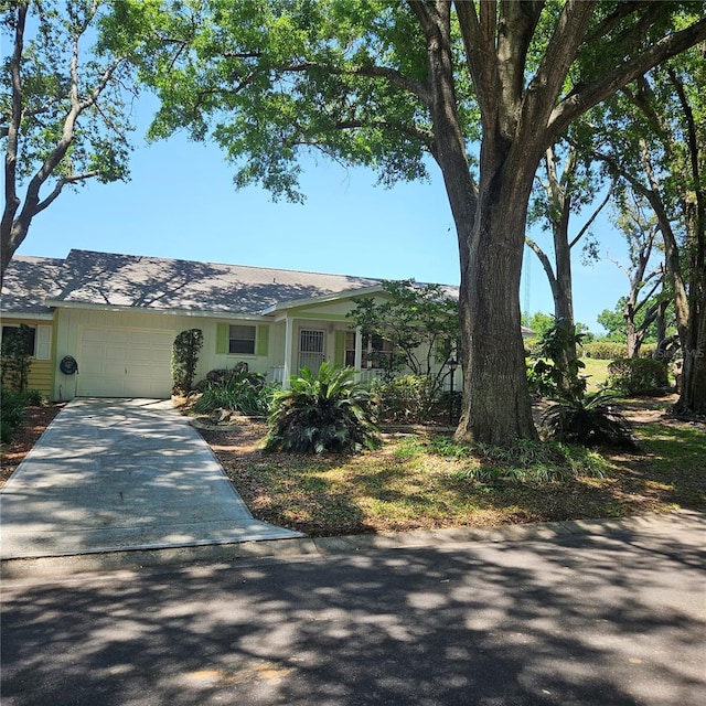8635 SW 95th St Unit G, Ocala, FL 34481 - view of front of house with a garage and driveway