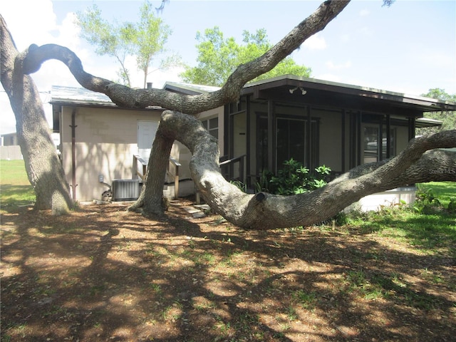 1675 SE 190th Ave, Silver Springs, FL 34488 - rear view of property featuring a sunroom