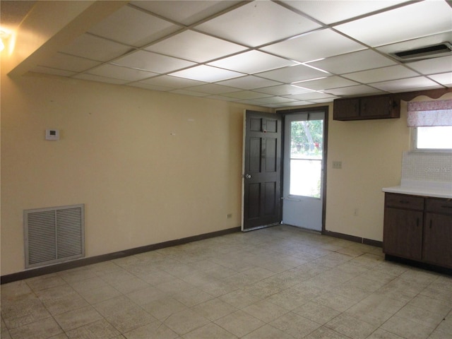 1675 SE 190th Ave, Silver Springs, FL 34488 - empty room featuring plenty of natural light, baseboards, and a paneled ceiling