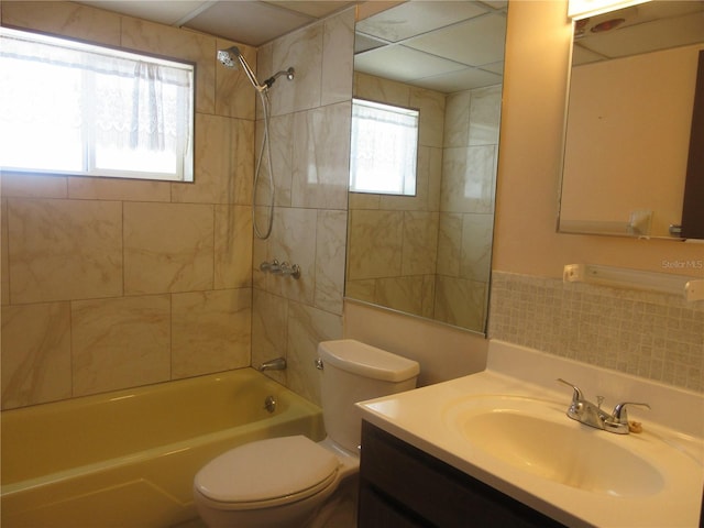 1675 SE 190th Ave, Silver Springs, FL 34488 - full bathroom featuring toilet, vanity, shower / bathtub combination, and tile walls