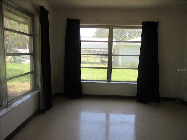 1675 SE 190th Ave, Silver Springs, FL 34488 - spare room with healthy amount of natural light and baseboards