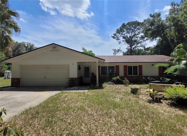 13385 NE 10th Ct, Citra, FL 32113 - ranch-style house with a garage, driveway, a front yard, and brick siding