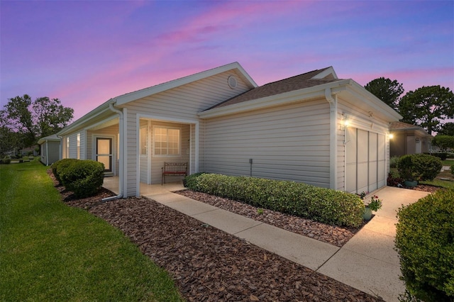 9408 SE 132nd Loop, Summerfield, FL 34491 - view of front of house featuring an attached garage and a yard