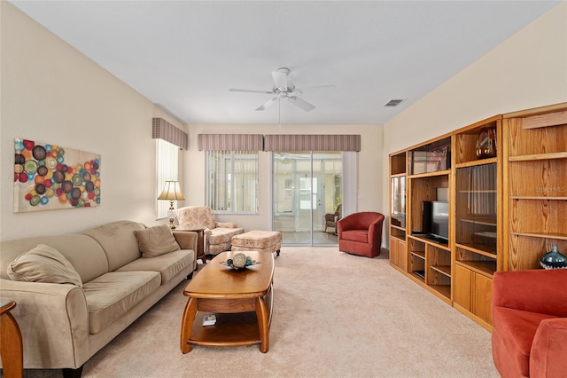 9408 SE 132nd Loop, Summerfield, FL 34491 - carpeted living area with a ceiling fan