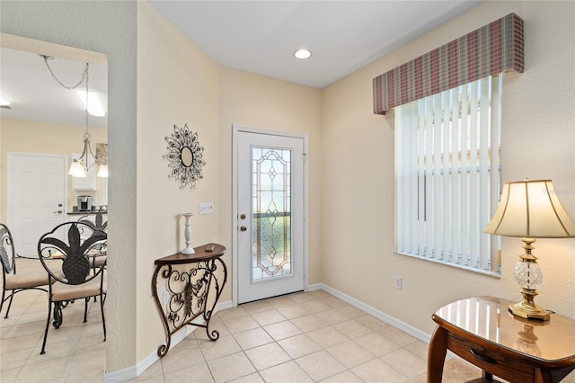 9408 SE 132nd Loop, Summerfield, FL 34491 - foyer with plenty of natural light, baseboards, and light tile patterned floors