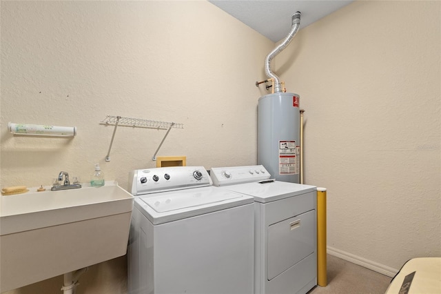 9408 SE 132nd Loop, Summerfield, FL 34491 - laundry room featuring water heater, washer and dryer, baseboards, and light carpet