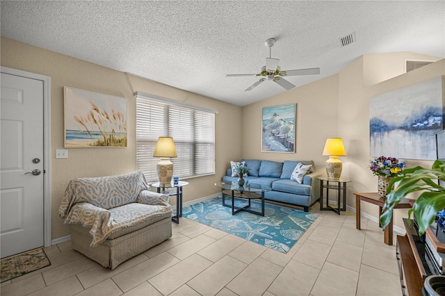 8137 SW 117th Loop, Ocala, FL 34481 - living area with a ceiling fan, lofted ceiling, a textured ceiling, baseboards, and light tile patterned floors