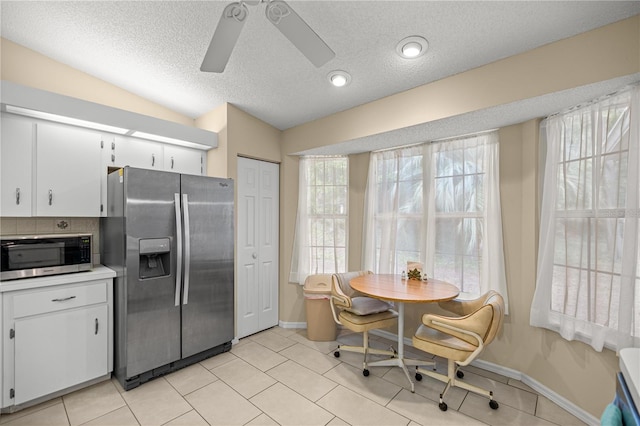 8137 SW 117th Loop, Ocala, FL 34481 - kitchen featuring appliances with stainless steel finishes, ceiling fan, white cabinets, a textured ceiling, and light countertops