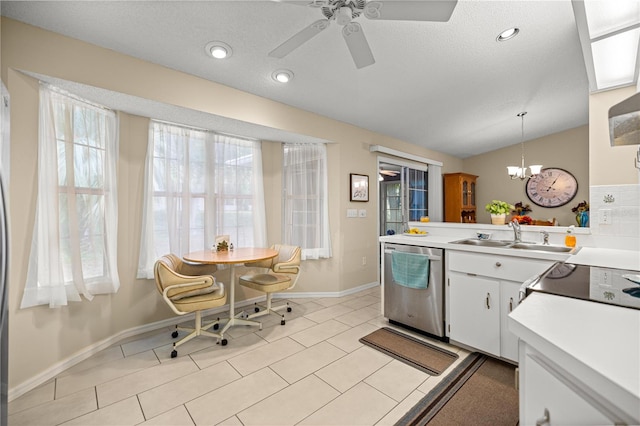 8137 SW 117th Loop, Ocala, FL 34481 - kitchen with dishwasher, a sink, healthy amount of natural light, lofted ceiling, and a textured ceiling