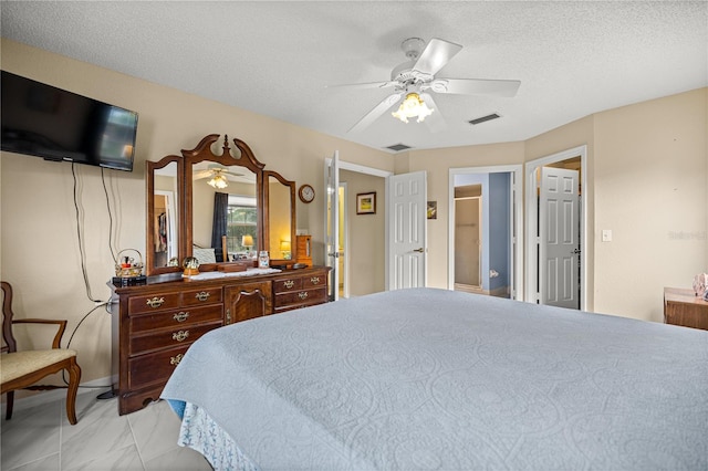 8137 SW 117th Loop, Ocala, FL 34481 - bedroom with a textured ceiling and ceiling fan