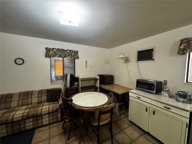 20704 SW Rainbow Lakes Blvd, Dunnellon, FL 34431 - dining area with a wall unit AC and tile patterned flooring