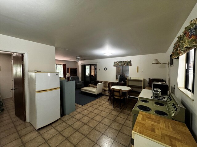 20704 SW Rainbow Lakes Blvd, Dunnellon, FL 34431 - kitchen featuring freestanding refrigerator, electric range, ceiling fan, and open floor plan