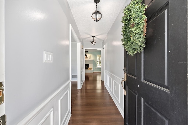1812 SE 38th Ave, Ocala, FL 34471 - hall with dark wood-style flooring and a textured ceiling