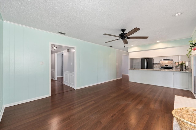 1812 SE 38th Ave, Ocala, FL 34471 - unfurnished living room featuring ceiling fan, dark wood finished floors, a textured ceiling, and ornamental molding
