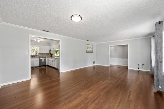 1812 SE 38th Ave, Ocala, FL 34471 - unfurnished living room with a textured ceiling, dark wood finished floors, a sink, and ornamental molding