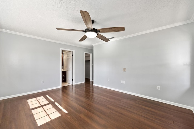 1812 SE 38th Ave, Ocala, FL 34471 - unfurnished bedroom featuring baseboards, a textured ceiling, crown molding, wood finished floors, and a spacious closet