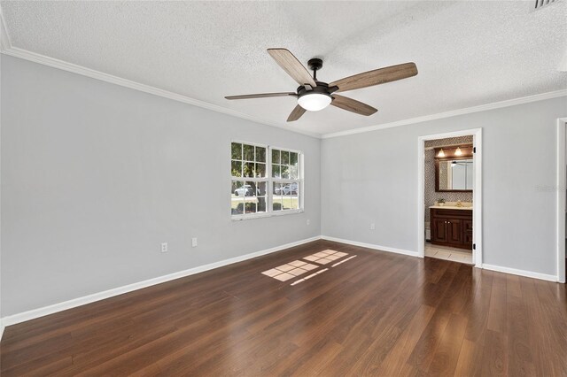 1812 SE 38th Ave, Ocala, FL 34471 - unfurnished bedroom with dark wood-style floors, a textured ceiling, ornamental molding, a sink, and baseboards