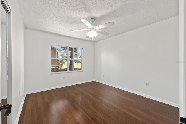 1812 SE 38th Ave, Ocala, FL 34471 - empty room with dark wood-type flooring, a ceiling fan, a textured ceiling, and baseboards