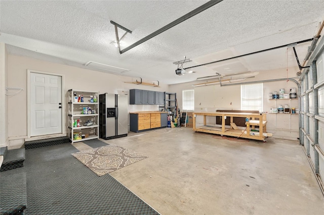 1812 SE 38th Ave, Ocala, FL 34471 - garage with stainless steel fridge with ice dispenser, a workshop area, and a garage door opener