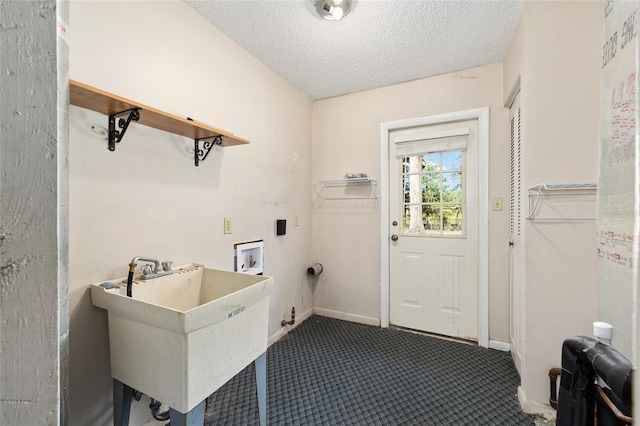 1812 SE 38th Ave, Ocala, FL 34471 - laundry area featuring washer hookup, dark carpet, and a textured ceiling
