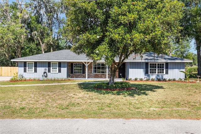 1812 SE 38th Ave, Ocala, FL 34471 - single story home with board and batten siding and a shingled roof