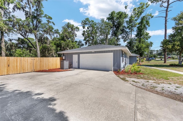 1812 SE 38th Ave, Ocala, FL 34471 - view of home's exterior with driveway, central AC unit, and a garage