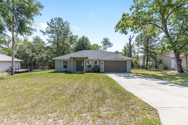 5425 Pecan Rd, Ocala, FL 34472 - ranch-style house featuring an attached garage, driveway, and stucco siding
