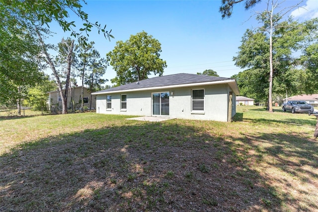5425 Pecan Rd, Ocala, FL 34472 - rear view of house featuring stucco siding